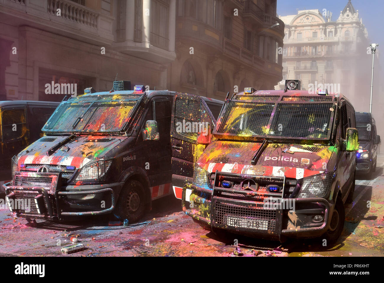 Two vehicles of the Mobile Brigade of the Catalan Police (Mossos d ¨Escuadra) seen with paint parked  during the protest. Clashes between pro-independence protesters and Catalan riot police during the protest of the JUSAPOL Police Syndicate that was in Barcelona demonstrating for wage equality and tribute to the National Police that prevented the referendum of 1 October. Stock Photo