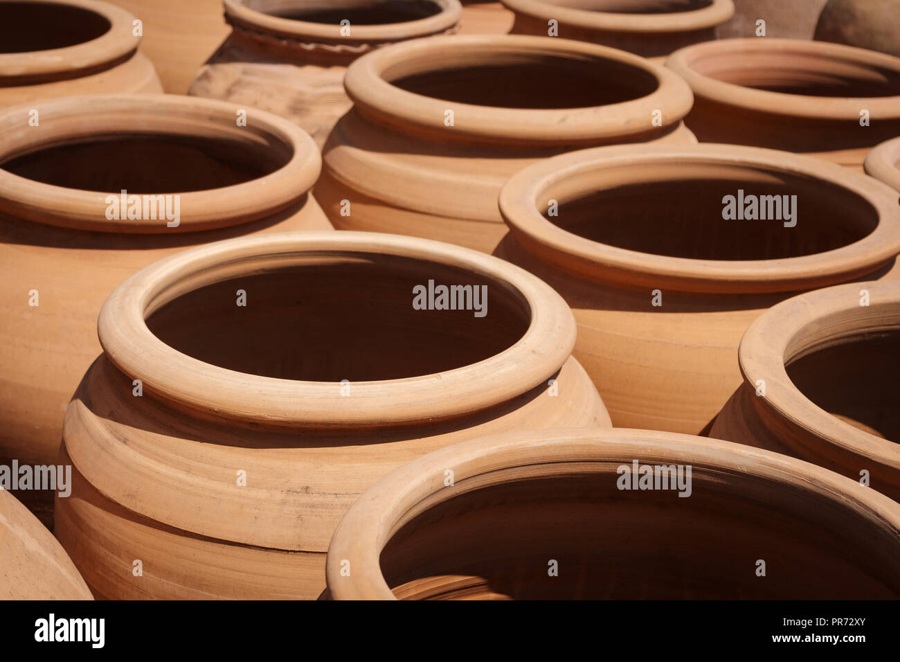 many clay pots, empty clay pot collection  - Stock Photo