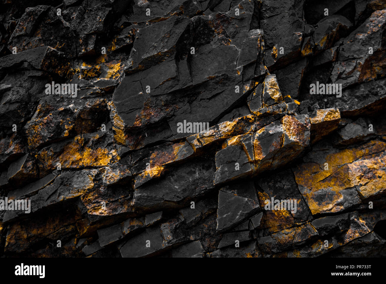 black rock background with golden / yellow color - Stock Photo