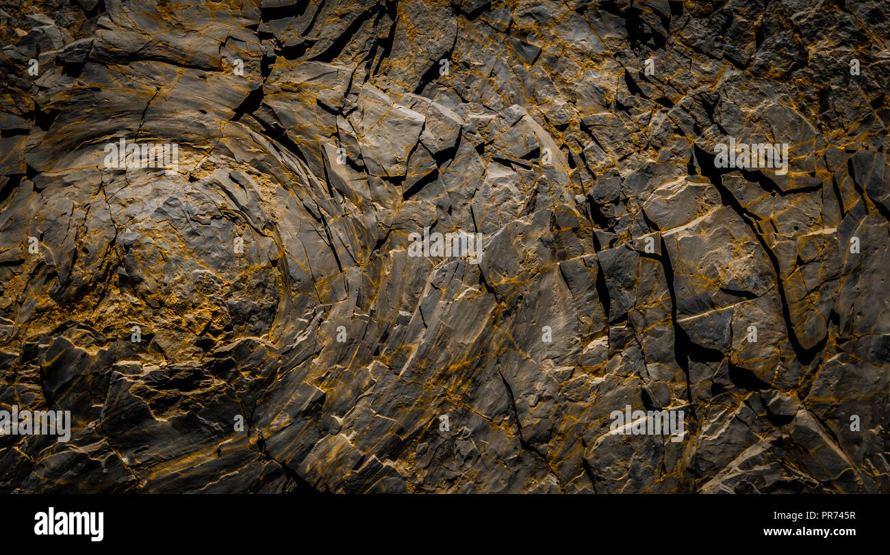 dark rocks  background - black rock stone texture Stock Photo
