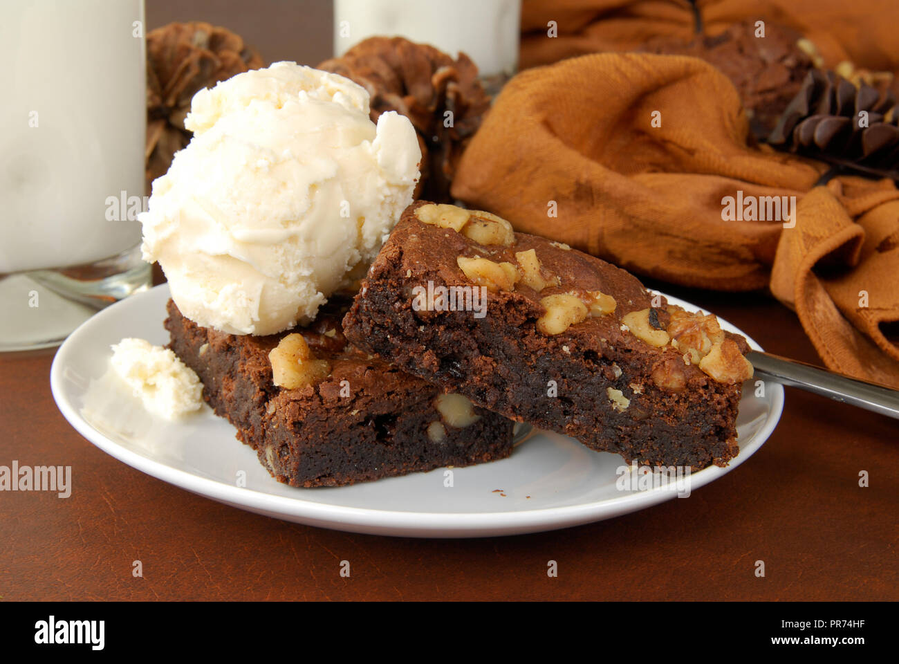 Chocolate fudge brownies with ice cream and milk Stock Photo Alamy