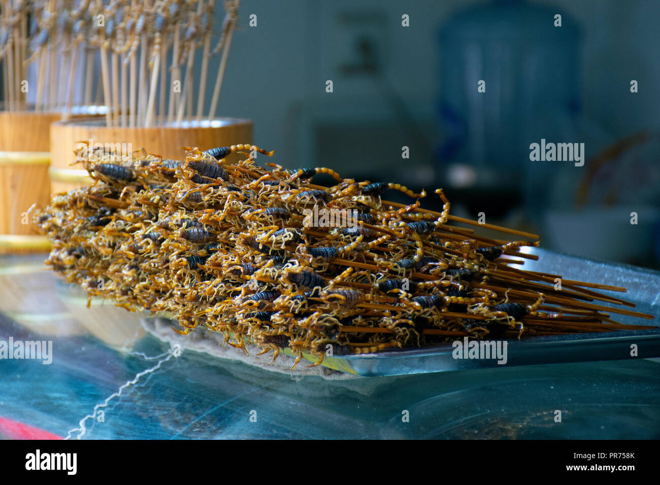 Black scorpions in a stick, exotic snack sold at the Wangfujing Snack Street, Beijing, China Stock Photo
