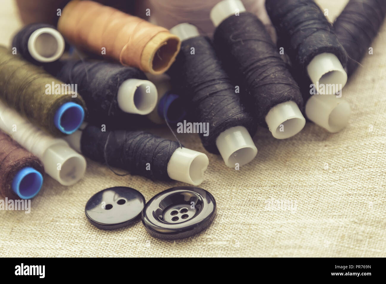 the composition of the seamstress, tailor, sewing thread and for knitting for the text substrate Stock Photo