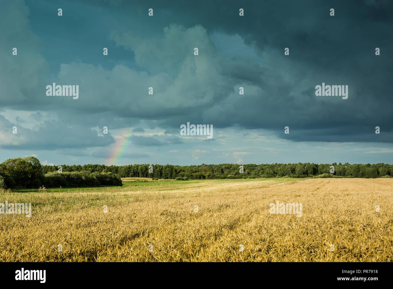 Dark clouds and rainbow hi-res stock photography and images - Alamy