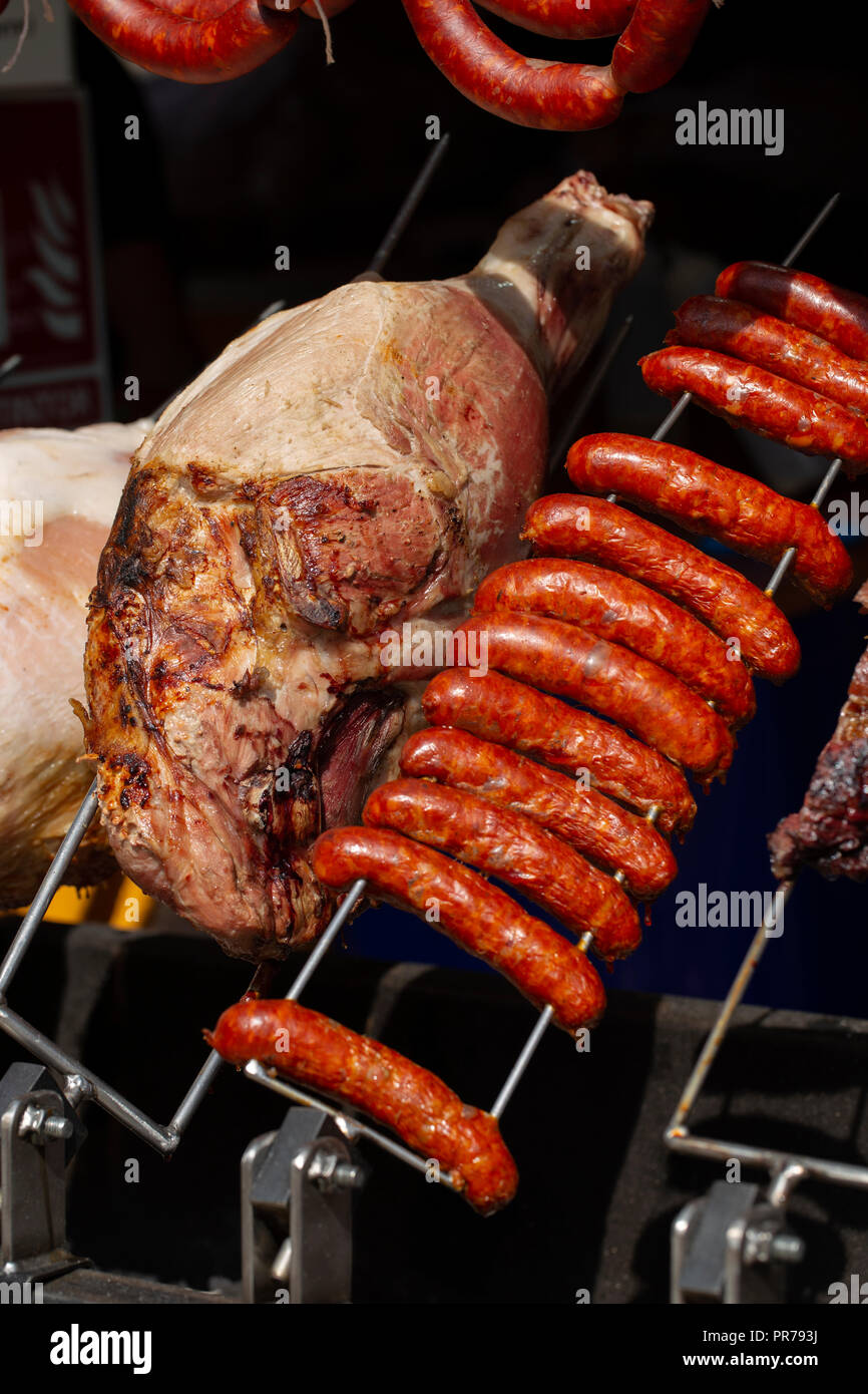 Meat on a rotisserie grill Stock Photo Alamy