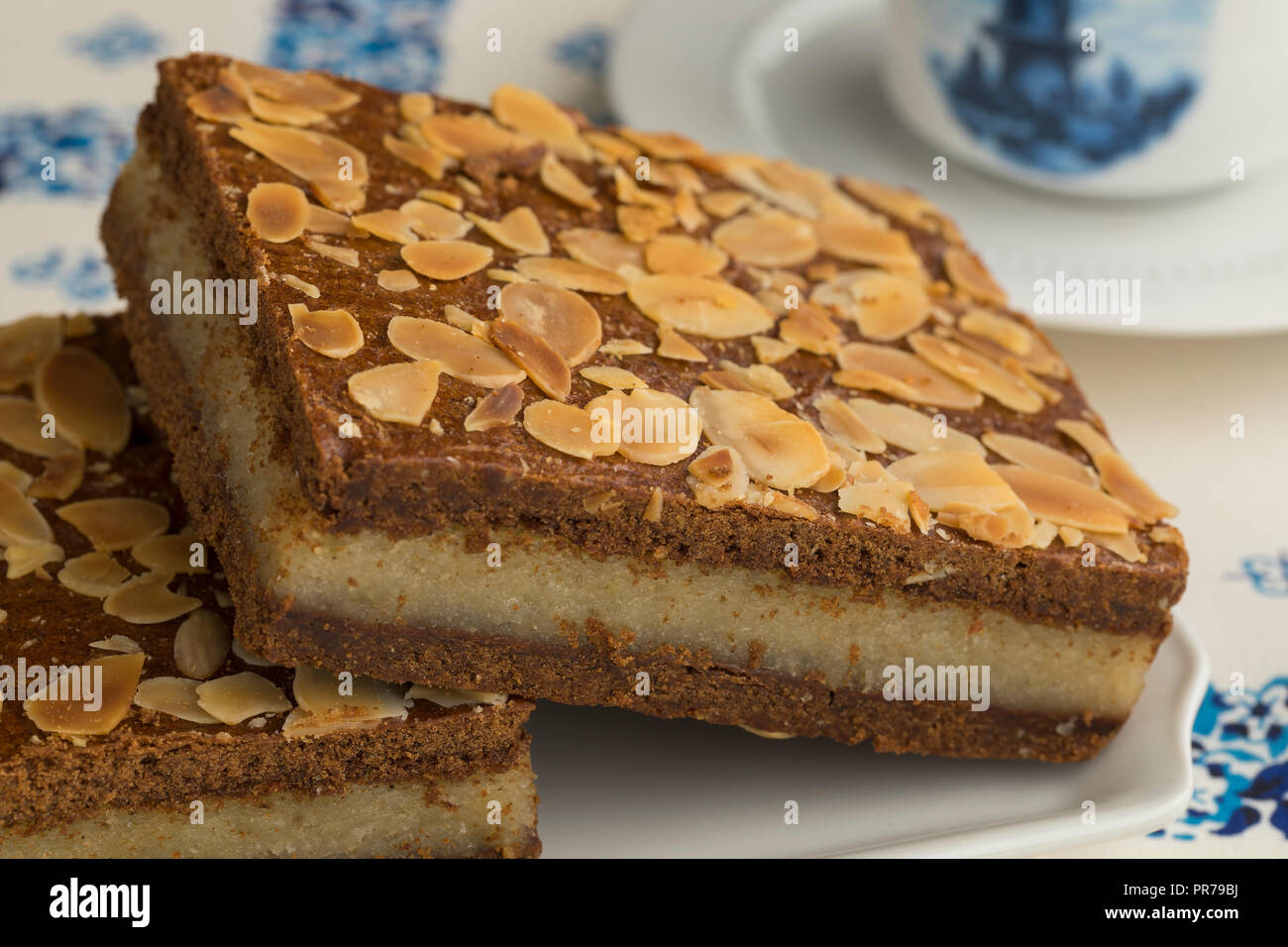 Pieces of typical Dutch treat called gevulde speculaas to be served at Sinterklaas evening Stock Photo