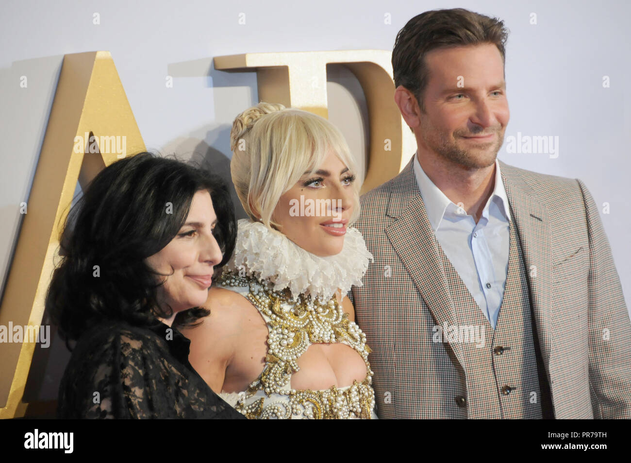 The London film premier of A Star is Born. Sue Kroll, Lady Gaga and Bradley Cooper pose for the cameras. Stock Photo