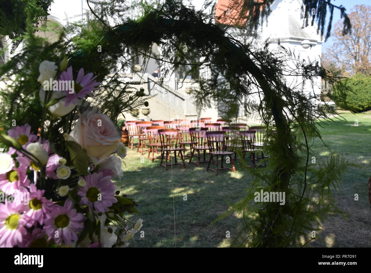 Vintage Chairs for wedding ceremony with flowers Stock Photo Alamy