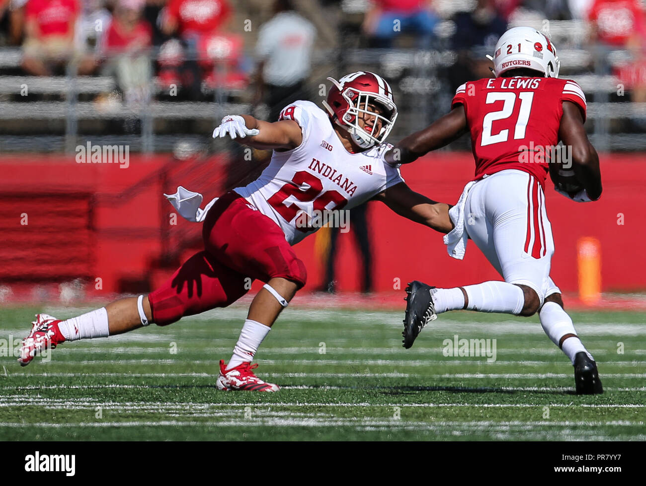 Piscataway, NJ, USA. 29th Sep, 2018. Rutgers Scarlet Knights wide receiver Eddie Lewis (21) tries to get around Indiana Hoosiers defensive back Khalil Bryant (29) during an NCAA football game between the Indiana Hoosiers and the Rutgers Scarlet Knights at HighPoint Solutions Stadium in Piscataway, NJ. Mike Langish/Cal Sport Media. Credit: csm/Alamy Live News Stock Photo
