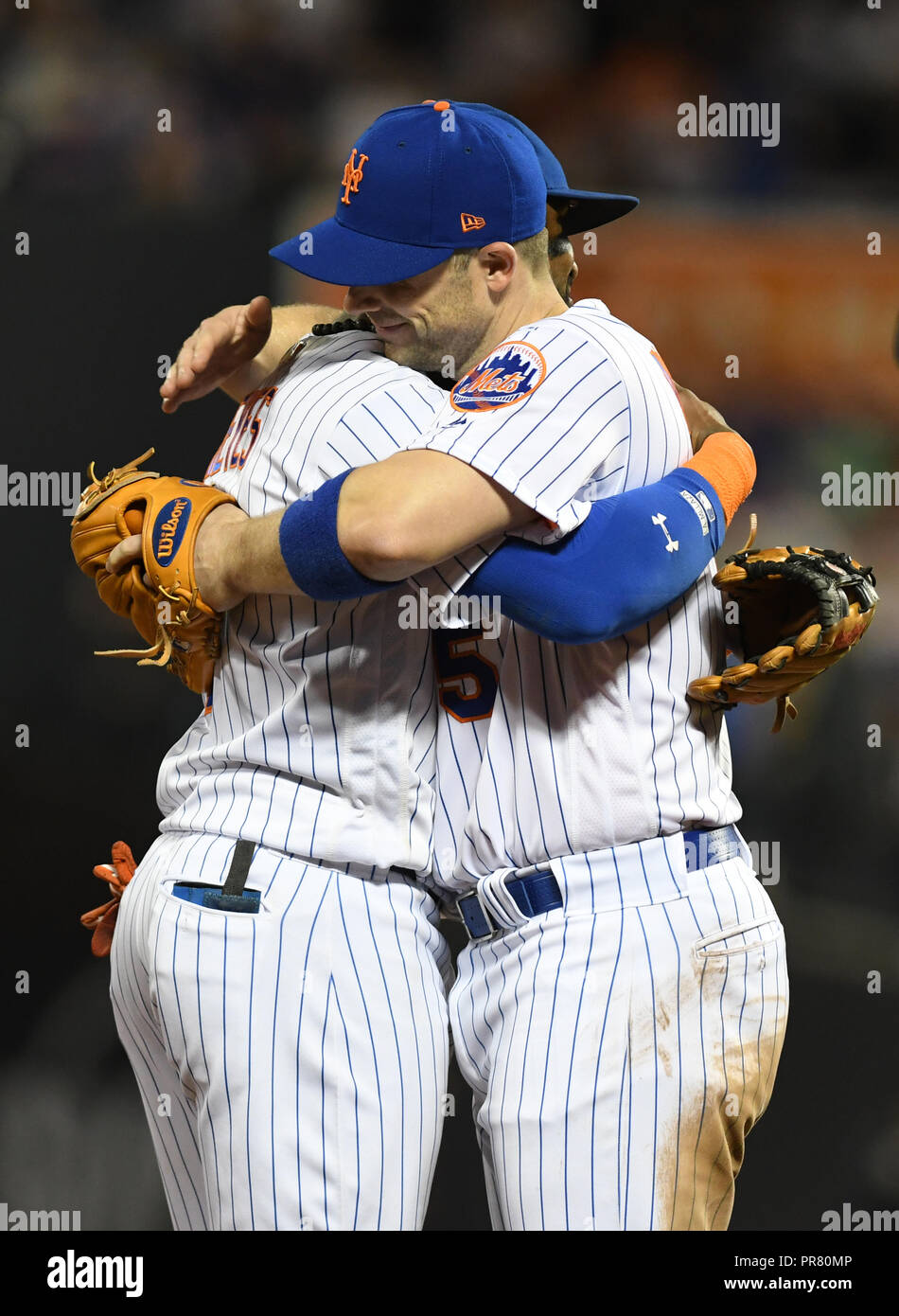 New York, NY, USA. 29th Sep, 2018. David Wright hugs Shortstop Jose Reyes  goodbye as he exits the game in his last NY Mets appearance before retiring  before the end of the