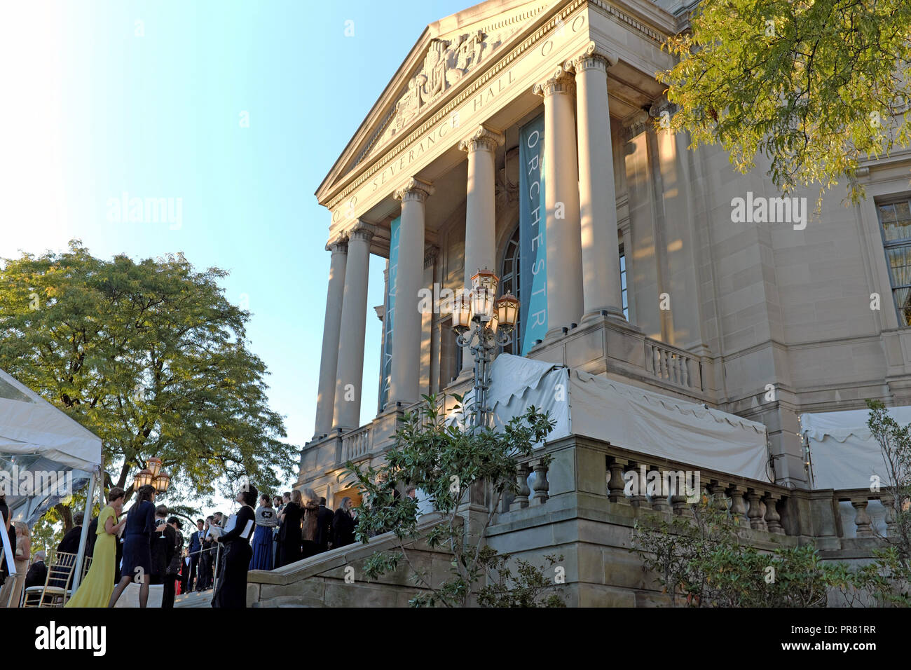 Cleveland, Ohio, USA. 29th Sept, 2018. Patrons socialize prior to attending the Cleveland Orchestra 100th Anniversary gala.  Severance Hall, home of the Cleveland Orchestra, hosted many benefactors and patrons on its front terrace prior to the performance.  Credit: Mark Kanning/Alamy Live News. Stock Photo