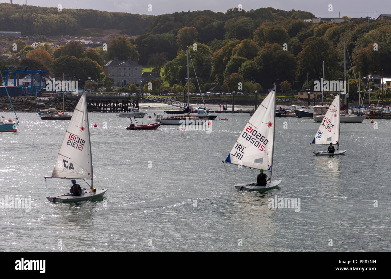 Crosshaven, Cork, Ireland. 30th September, 2018. Three Laser sailing dinghys return to the Royal Cork Yacht Club after a morning out in the harbour. Credit: David Creedon/Alamy Live News Stock Photo