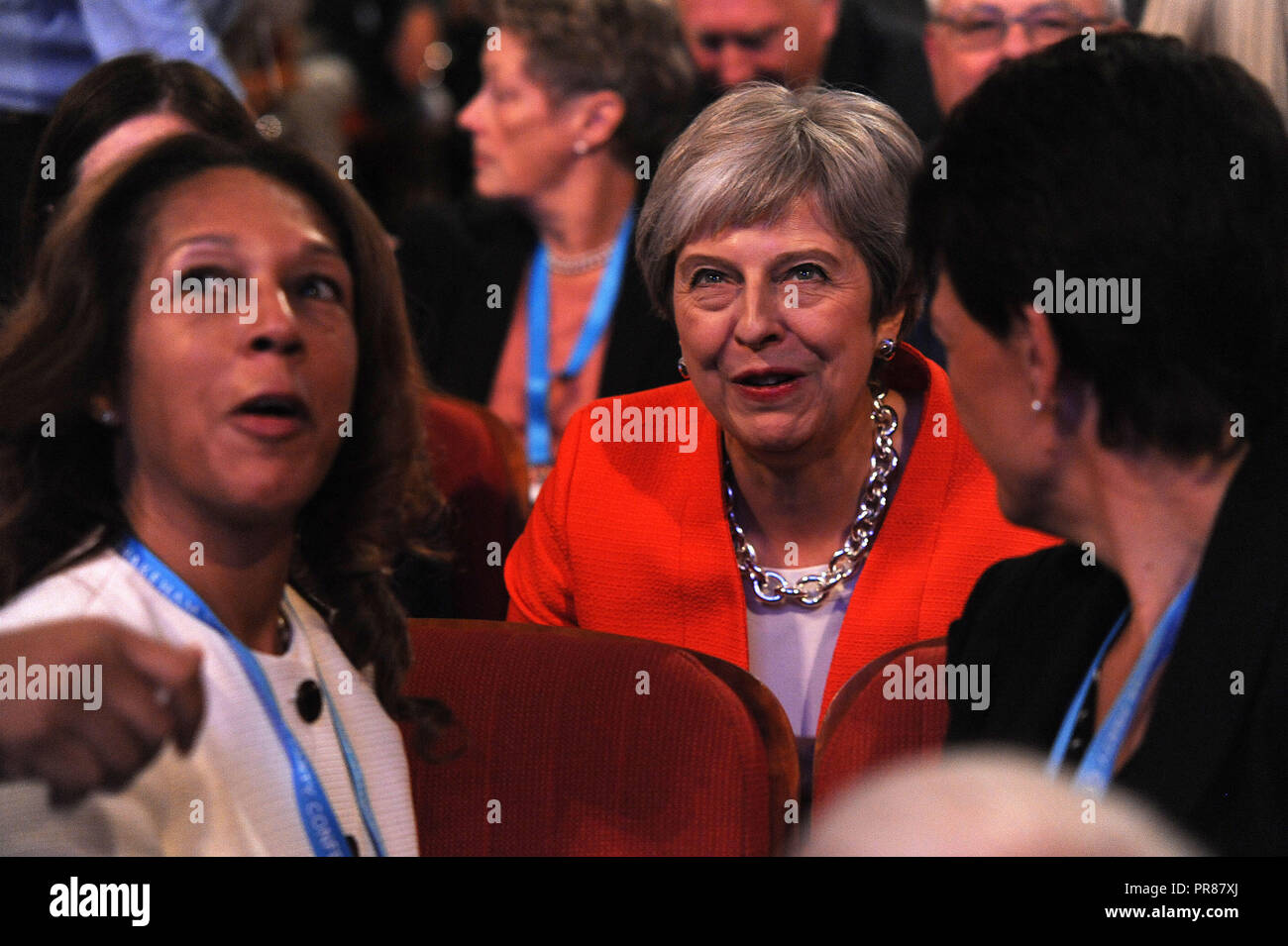 Birmingham, UK. 30th September, 2018.  Theresa May MP, Prime Minister and Leader of the Conservative Party, listening to opening speeches to conference, and talking to delegates, on the first session of the first day of the Conservative Party annual conference at the ICC.  Kevin Hayes/Alamy Live News Stock Photo