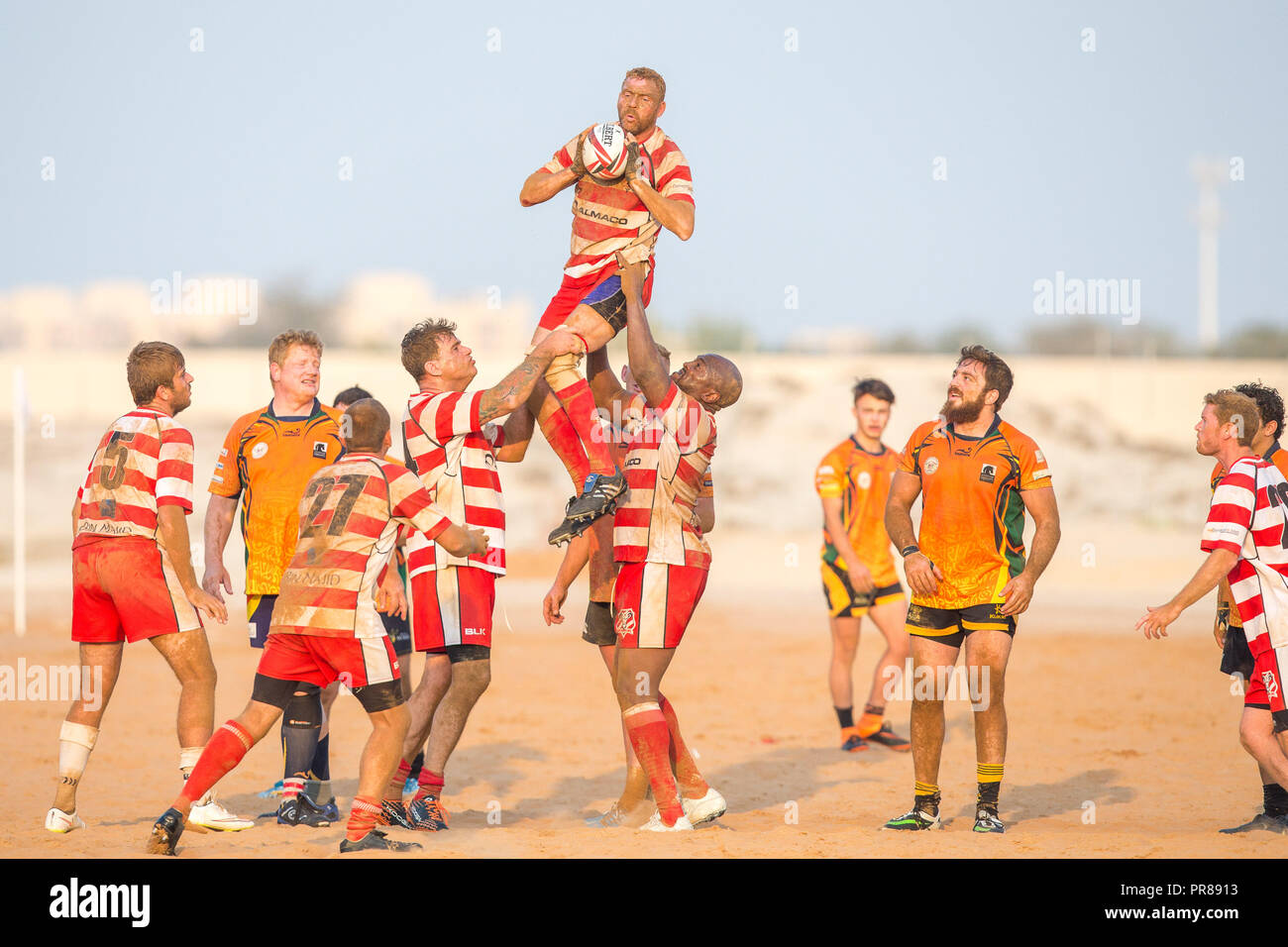December 16, 2016 - Ras Al Khaimah, Ras Al Khaimah, United Arab Emirates - Team players seen in action at their sand pitch during the game.Rugby in RAK has been reported to have been played in the region since 1969 in various forms, the senior men's team is currently playing in the Community League in the UAE and also it has a youth team as well as a woman's sevens team. The remarkable thing about the RAK Rugby Club is that their home ground is a sand pitch located at Bin Majid Resort in Ras Al Khaimah, their seasons run from September to April every year and it's governed by the UAE Rugb Stock Photo