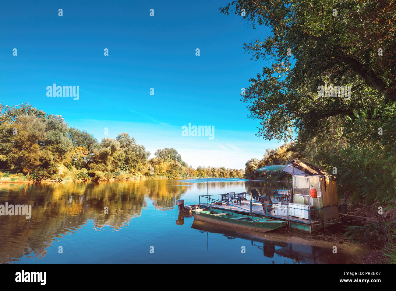 Fishing Rafts For Rivers River with fishing raft and boats Stock Photo - Alamy