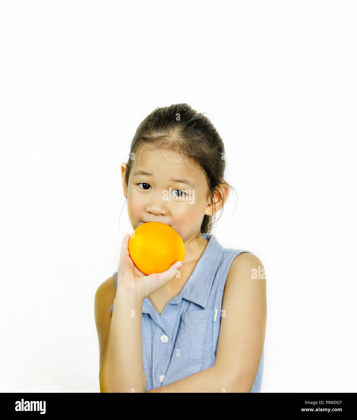asian little girl holding fresh orange on white background Stock Photo ...
