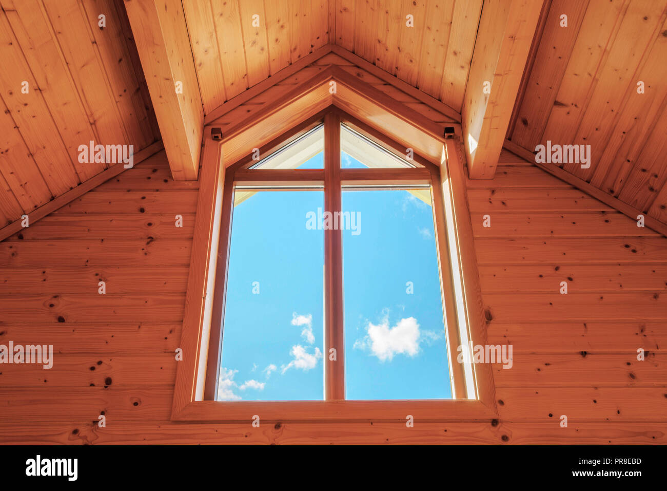 Wooden Skylight Window, large luxury window with a blue sky Stock Photo