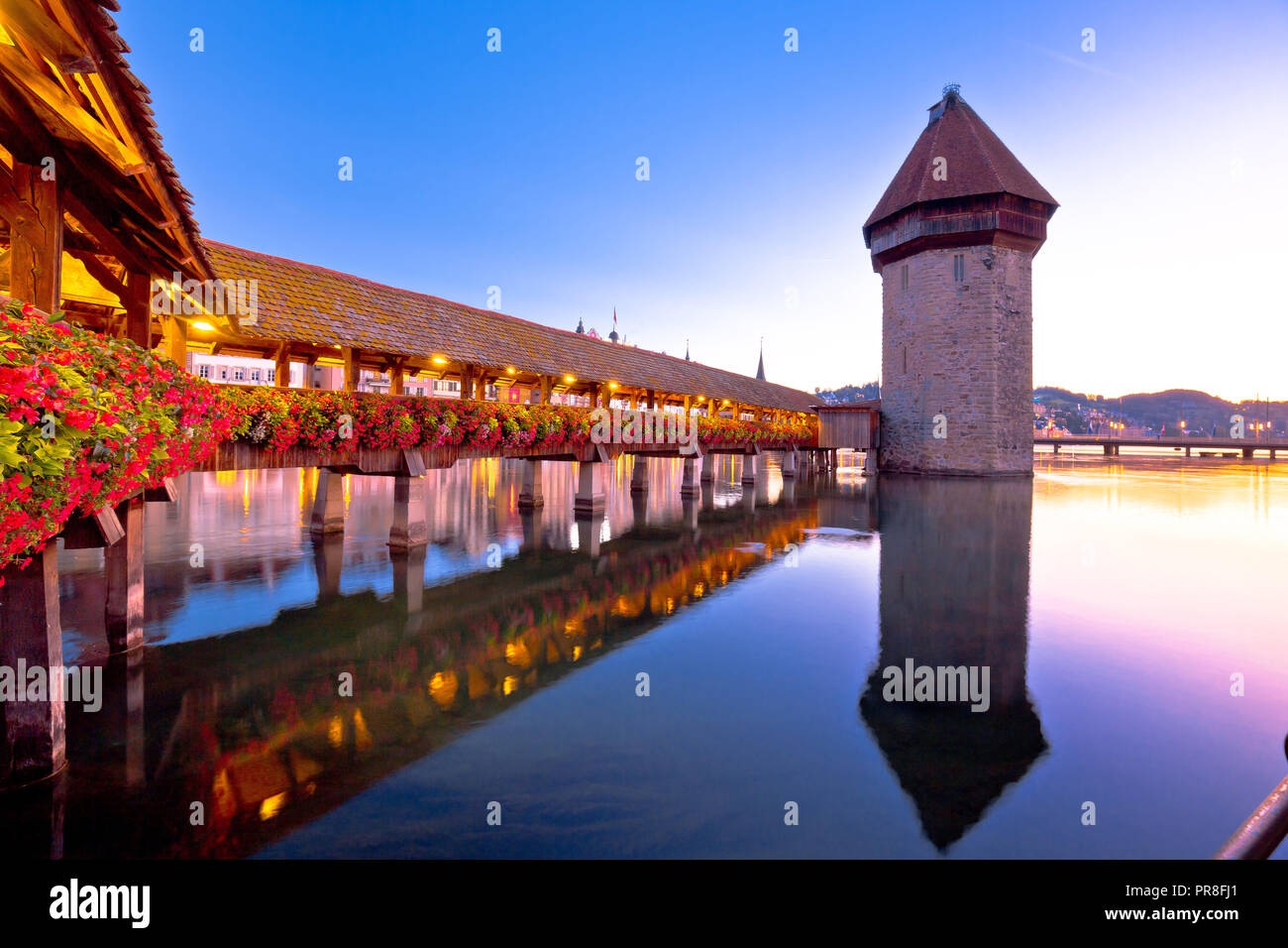 Luzern wooden Chapel Bridge and tower dawn view, town in central Switzerland Stock Photo
