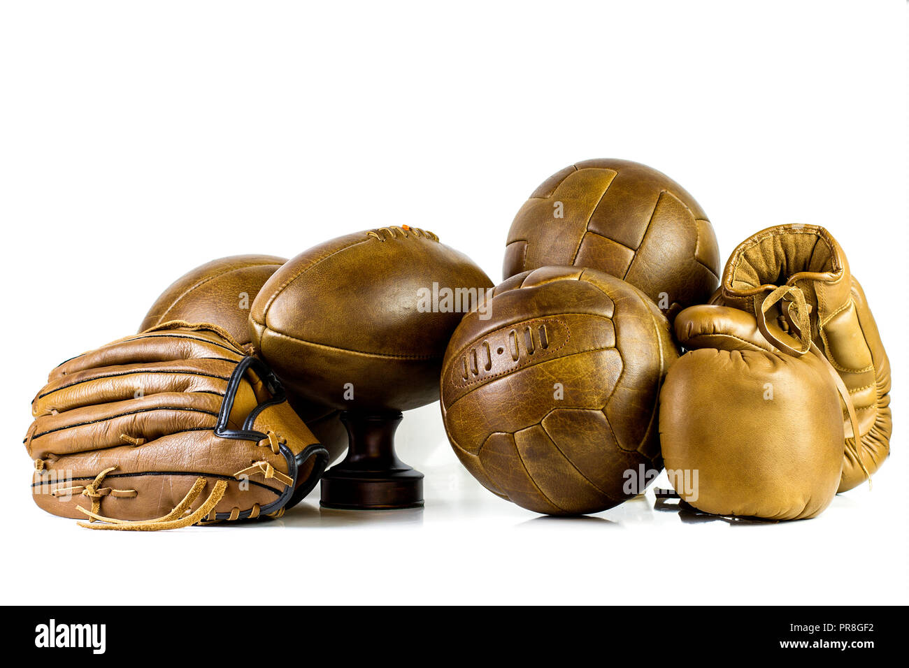 Collection of vintage leather lace up sports equipment Stock Photo