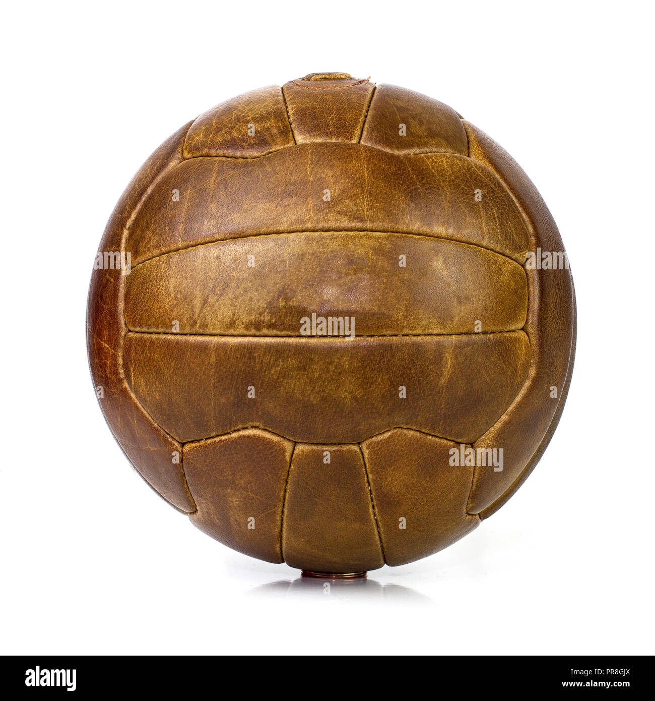 vintage lace up leather football soccer ball on site background Stock Photo