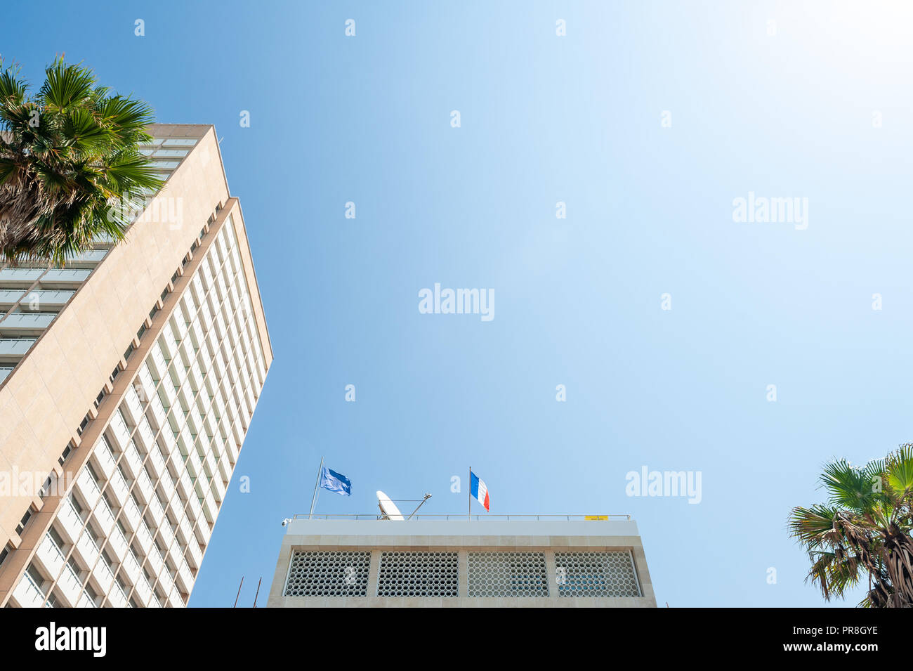 Israel, Tel Aviv - 24 September 2018: French flag and European flag on the Embassy of France Stock Photo