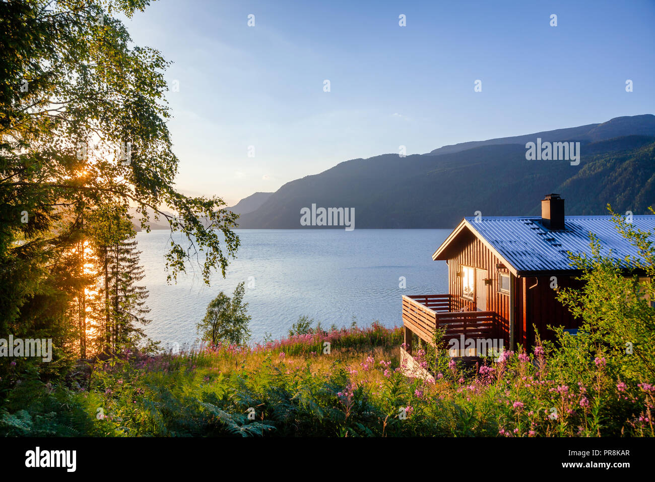 Norwegian wooden summer house (Hytte) with terrace overlooking scenic