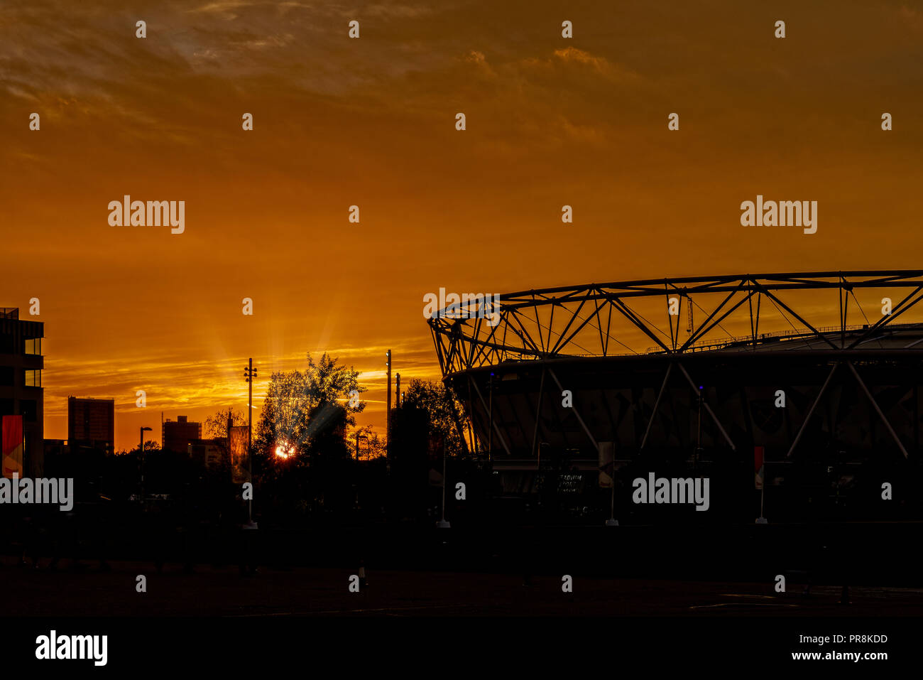 The silhouette of the Olympic Stadium in the Queen Elizabeth Park in London as the sunsets Stock Photo