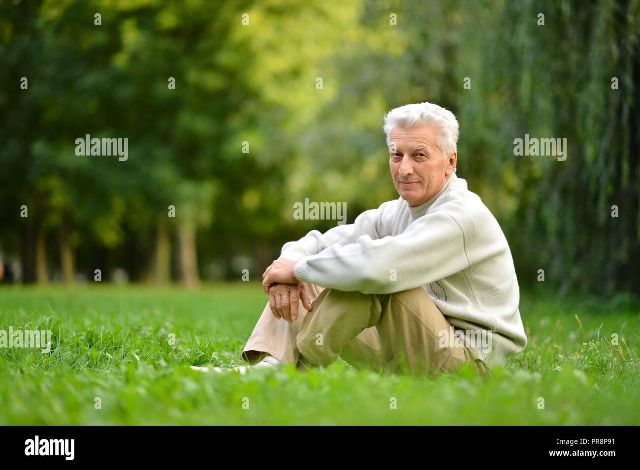 Senior guy in white hi-res stock photography and images - Alamy