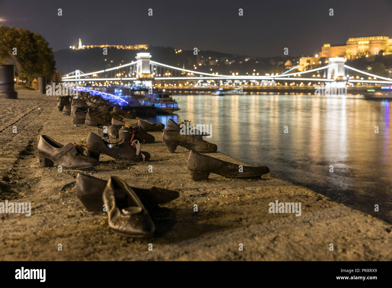 A poignant memorial on the bank of the Danube in Budapest are these cast iron shoes sculpted by Gyula Pauer and conceived by Can Togay. The shoes comm Stock Photo