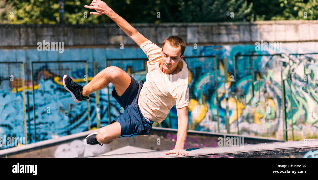 Adult Man Training Parkour While Jump Over Obstacles Stock Photo Alamy Adult Man Training Parkour While Jump Over Obstacles Stock Photo Alamy