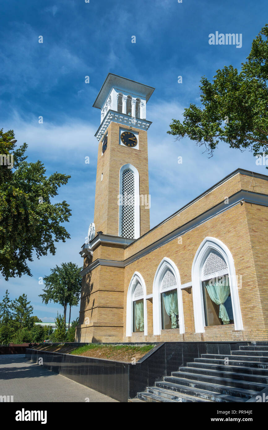High clock tower in Tashkent against the blue sky, Uzbekistan Stock