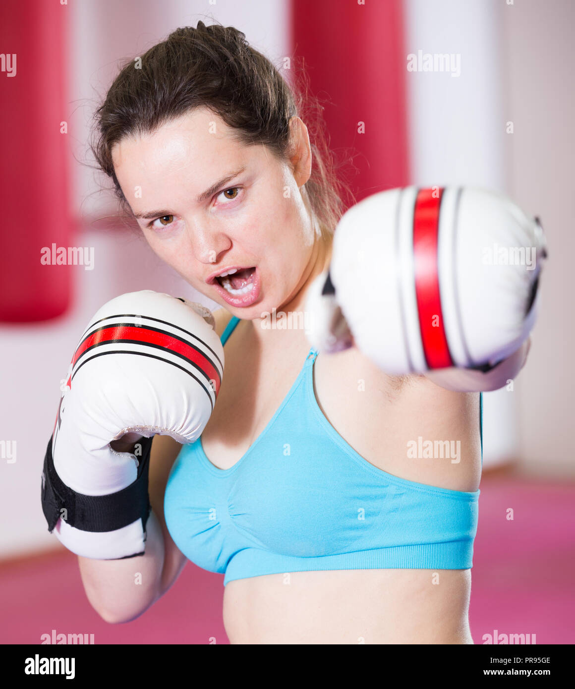Young active female practicing different in boxing hall Stock Photo Alamy