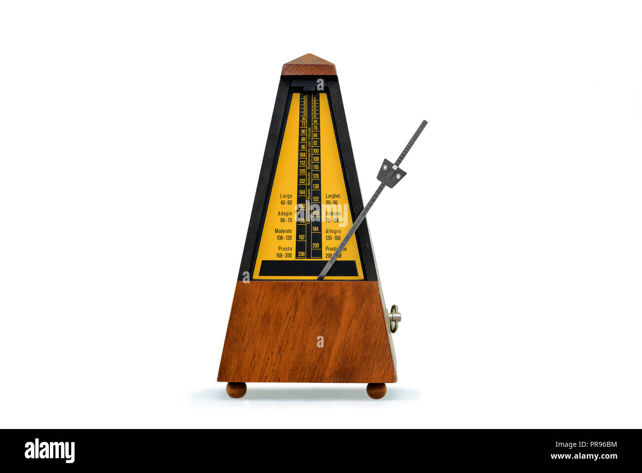 mechanical brown antique metronome on white Stock Photo