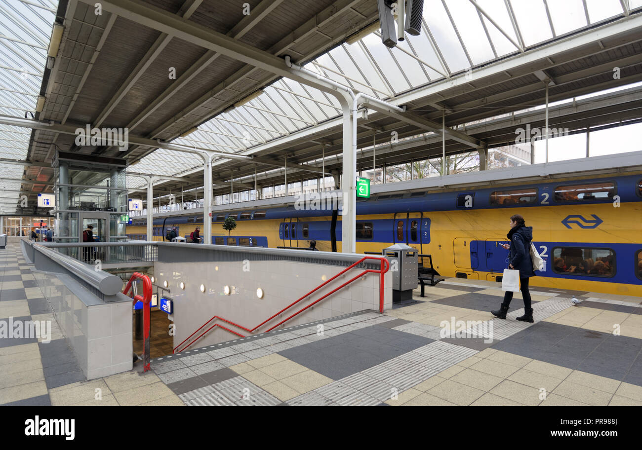 Amsterdam, Netherlands - January 1, 2017: People on the platform of metro and train station. The metro system consists of five routes and serves 58 st Stock Photo