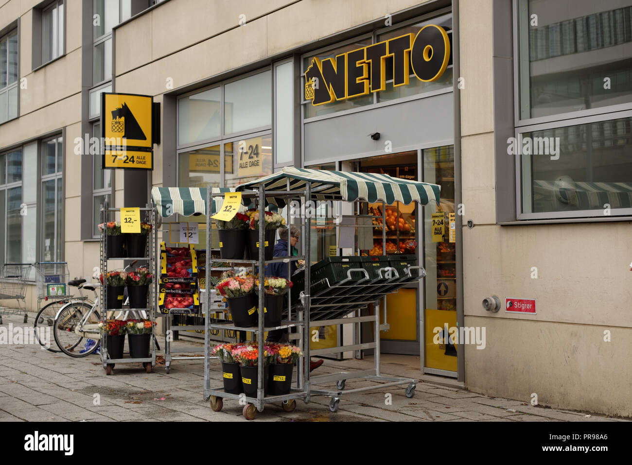 Copenhagen, Denmark - November 5, 2016: People at the entrance in a supermarket Netto. Netto entered on the supermarket scene in the 1980s when many D Stock Photo