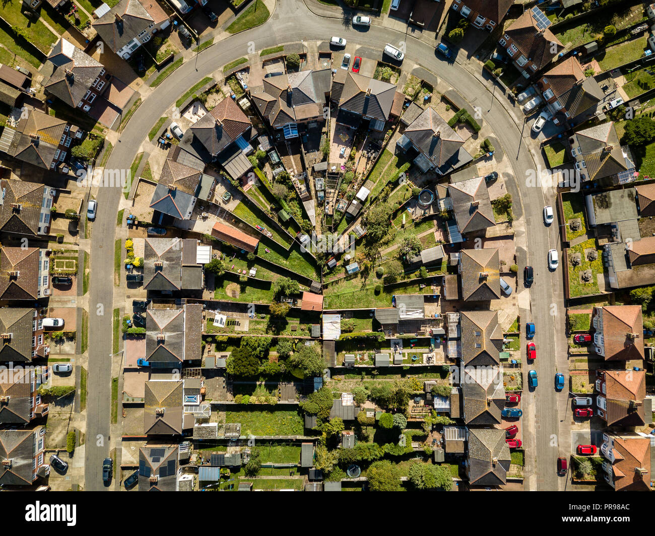 Aerial view of suburban houses in Ipswich, UK. U shaped street. Nice sunny day. Stock Photo