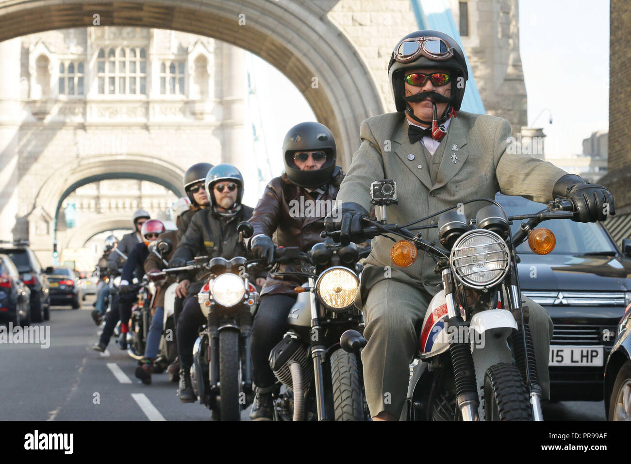 EDITORIAL USE ONLY Riders travel over Tower Bridge in London during the