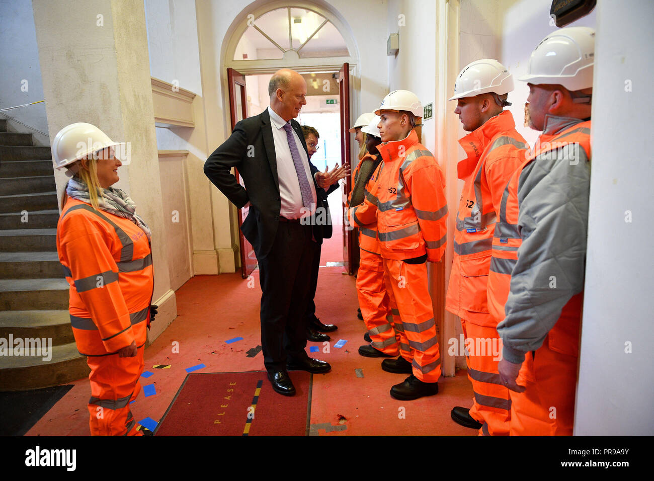 Leader of the House of Commons and Secretary of State for Transport, Chris Grayling meets with construction workers at the Old Curzon Street station site, Birmingham, where work is underway to build the HS2 terminal. Stock Photo