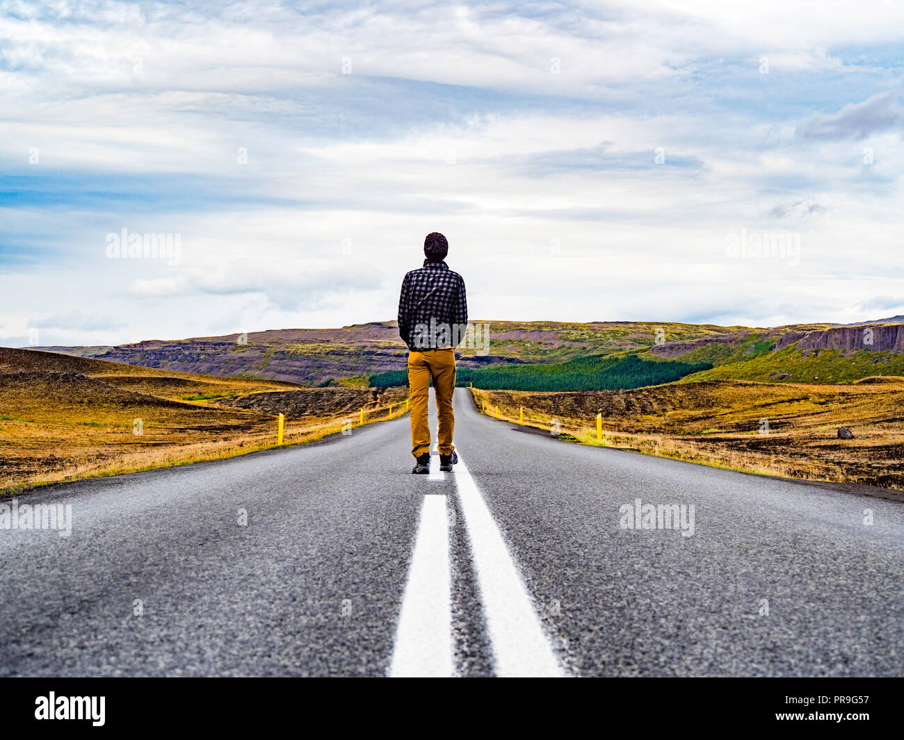 Man walking into the unknown road Stock Photo