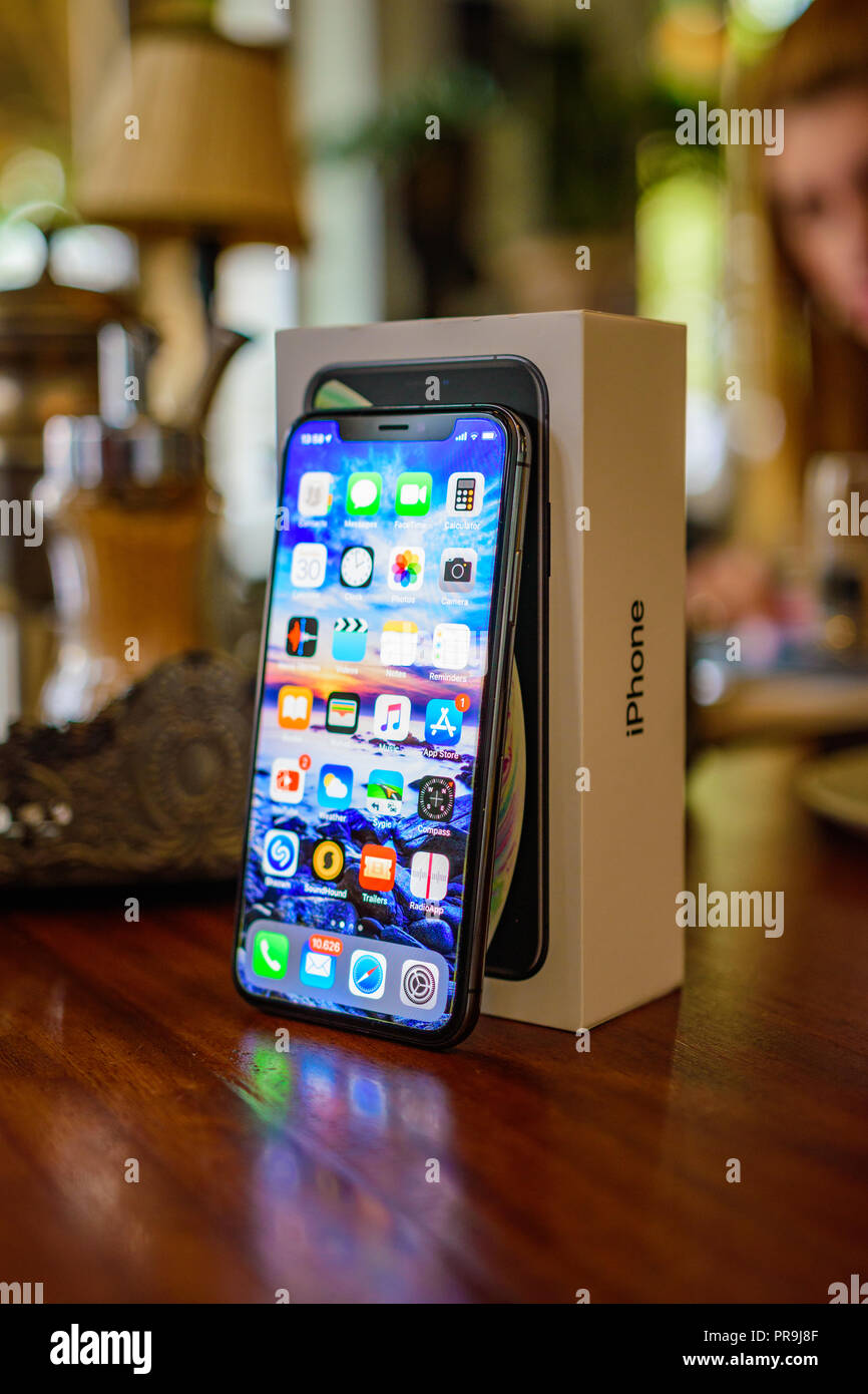 KALAMATA, GREECE - SEPTEMBER 30 2018: Close up photo of the Iphone XS model. The new Apple ten S in black color on a vintage wooden desk Stock Photo