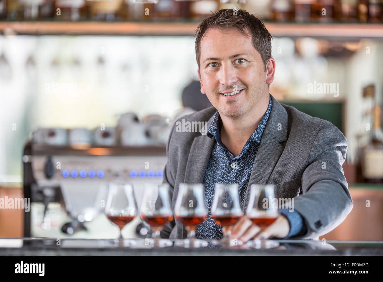 Bartender behind bar counter hi-res stock photography and images - Alamy