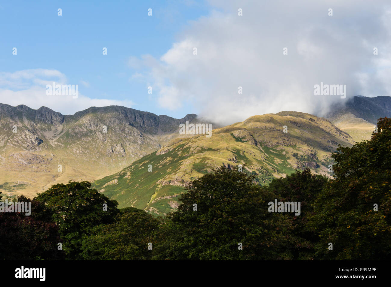 The Band and Crinkle Crags mountain on left in the Lake District, Cumbria, England. Stock Photo