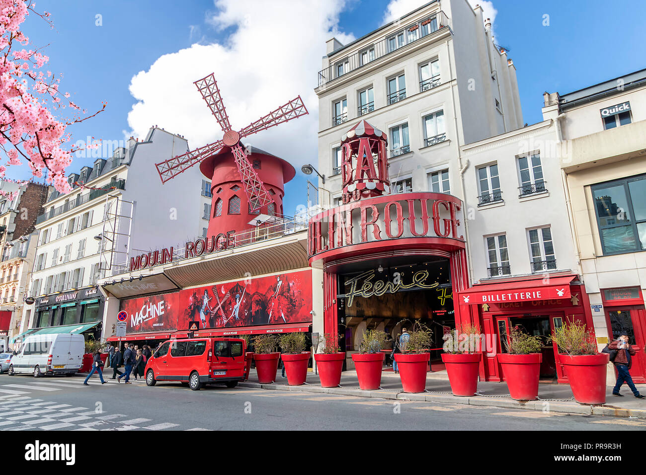 Moulin Rouge - famous cabaret built in 1889, in red-light district Pigalle on Boulevard de Clichy Stock Photo