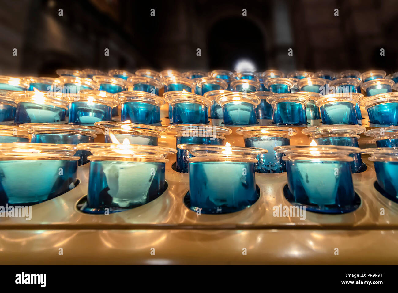 Prayer candles in offertory Stock Photo Alamy