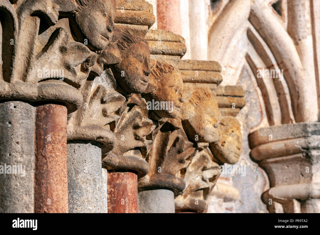 Stone capital heads in the  Royal Monastery of Guadalupe, , Guadalupe, Caceres province, Extremadura, Spain Stock Photo