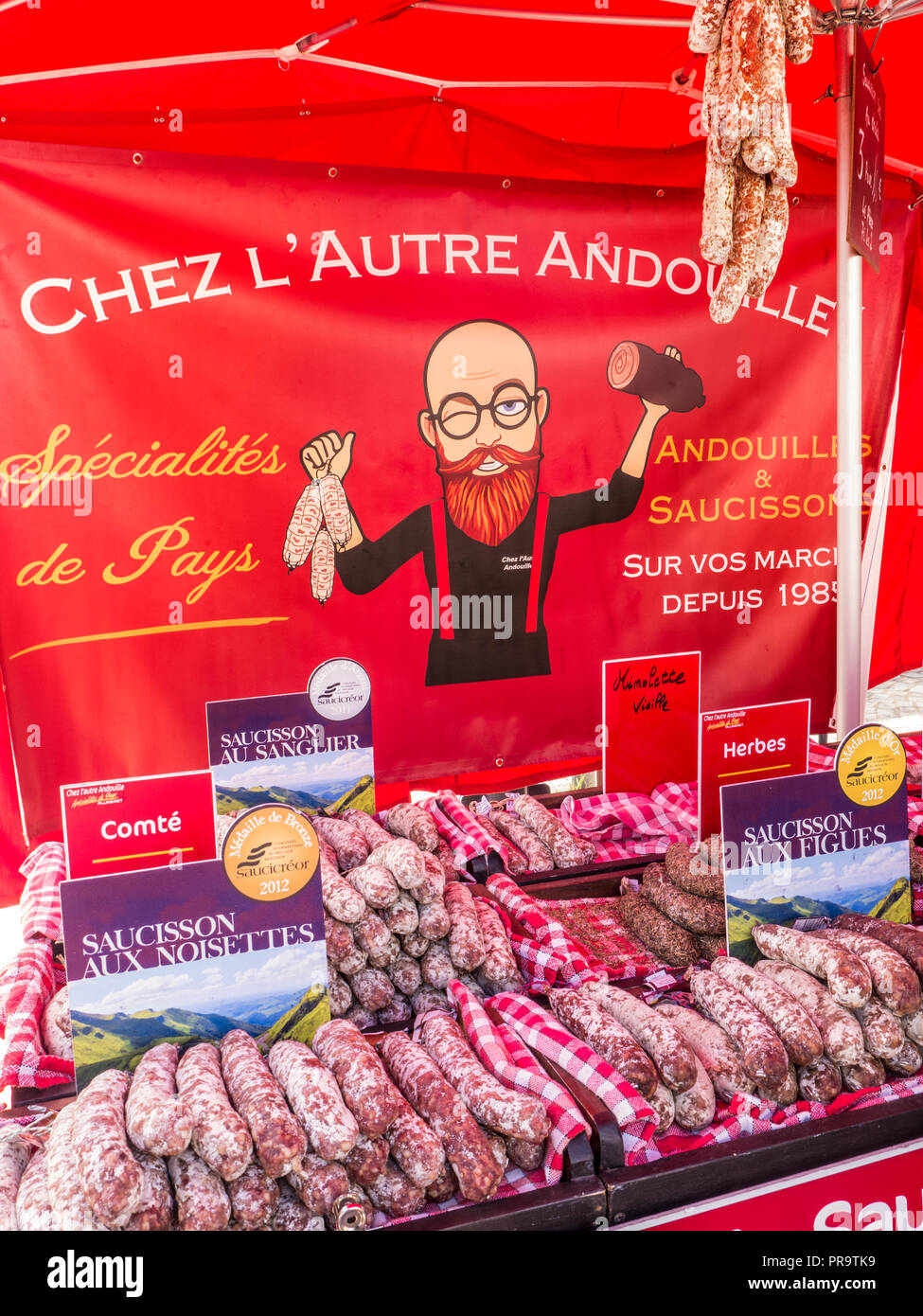 Concarneau outdoor French flavoured Saucisson Andouillets meats produce market stall Concarneau Bretagne Brittany France Stock Photo