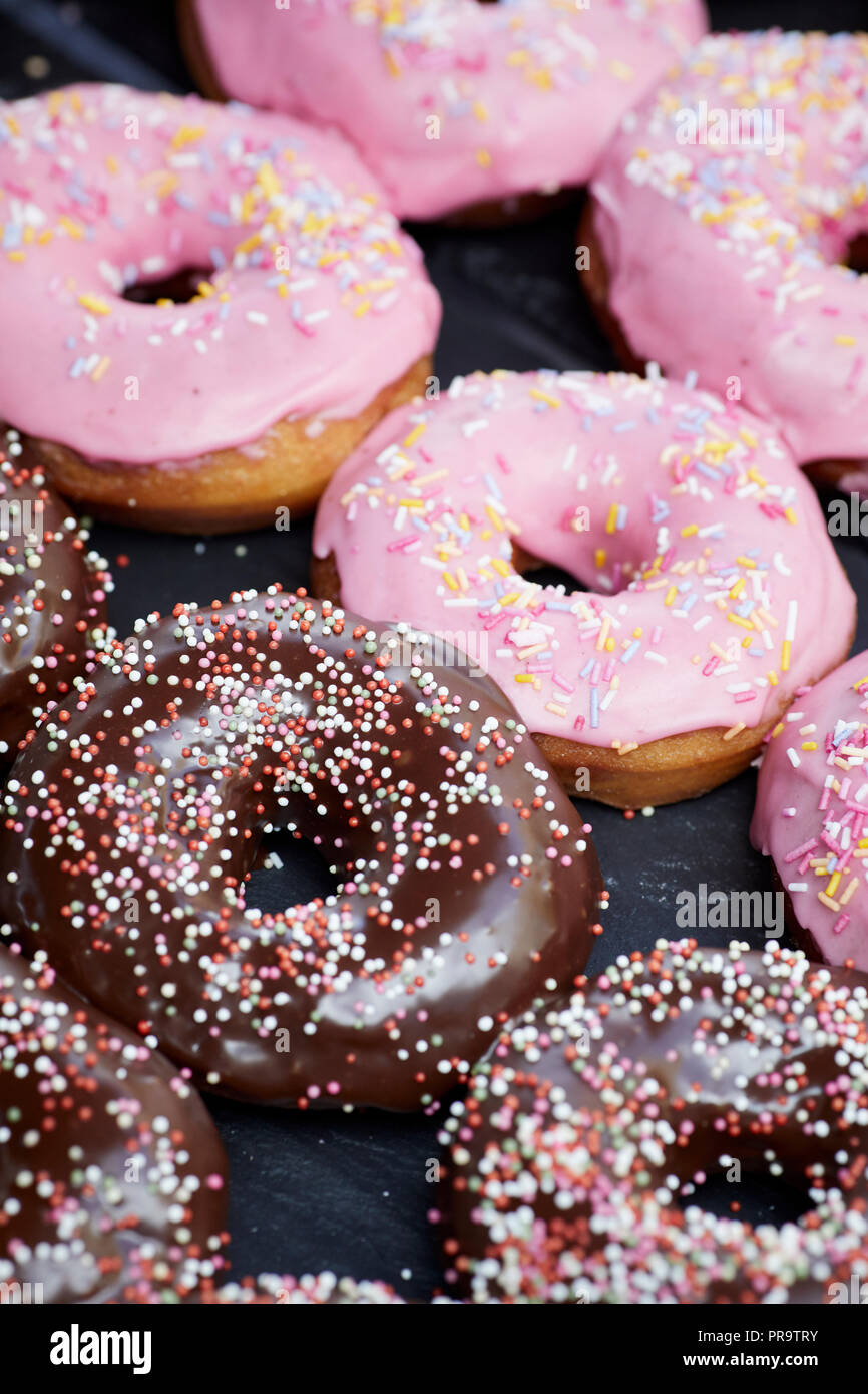 Glazed donuts with sprinkles Stock Photo Alamy