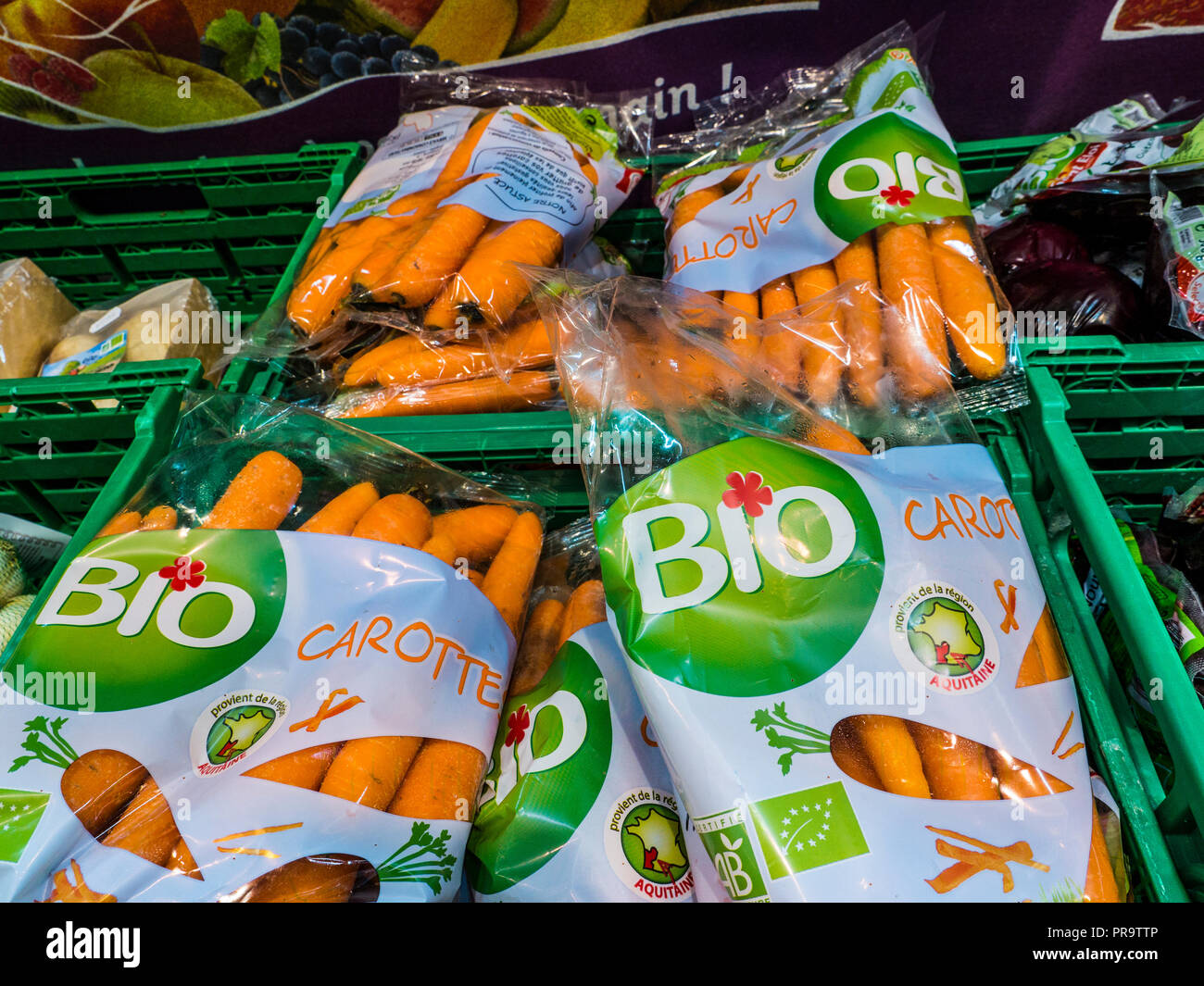 BIO Biodynamic organic carrots (carottes) packaged on display for sale in French Supermarket Stock Photo