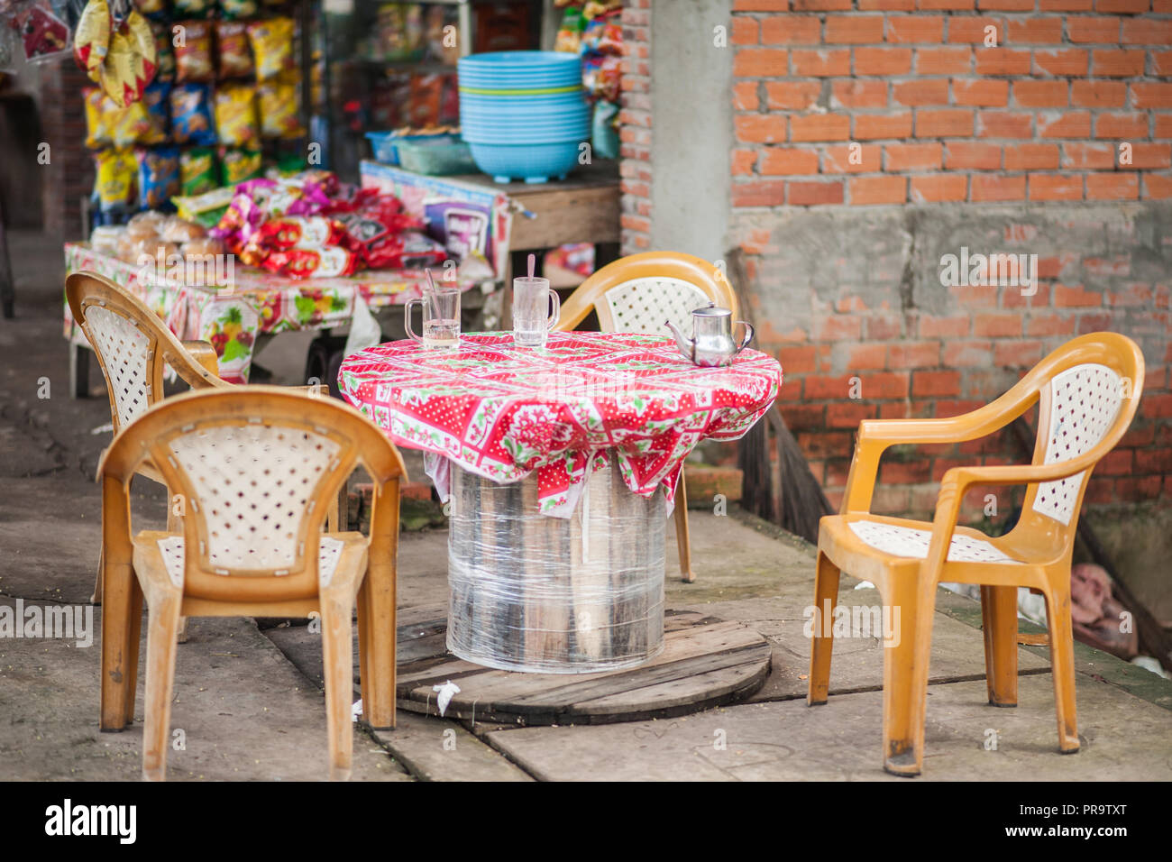 Simple outdoor cafe and seating area where tourists can enjoy