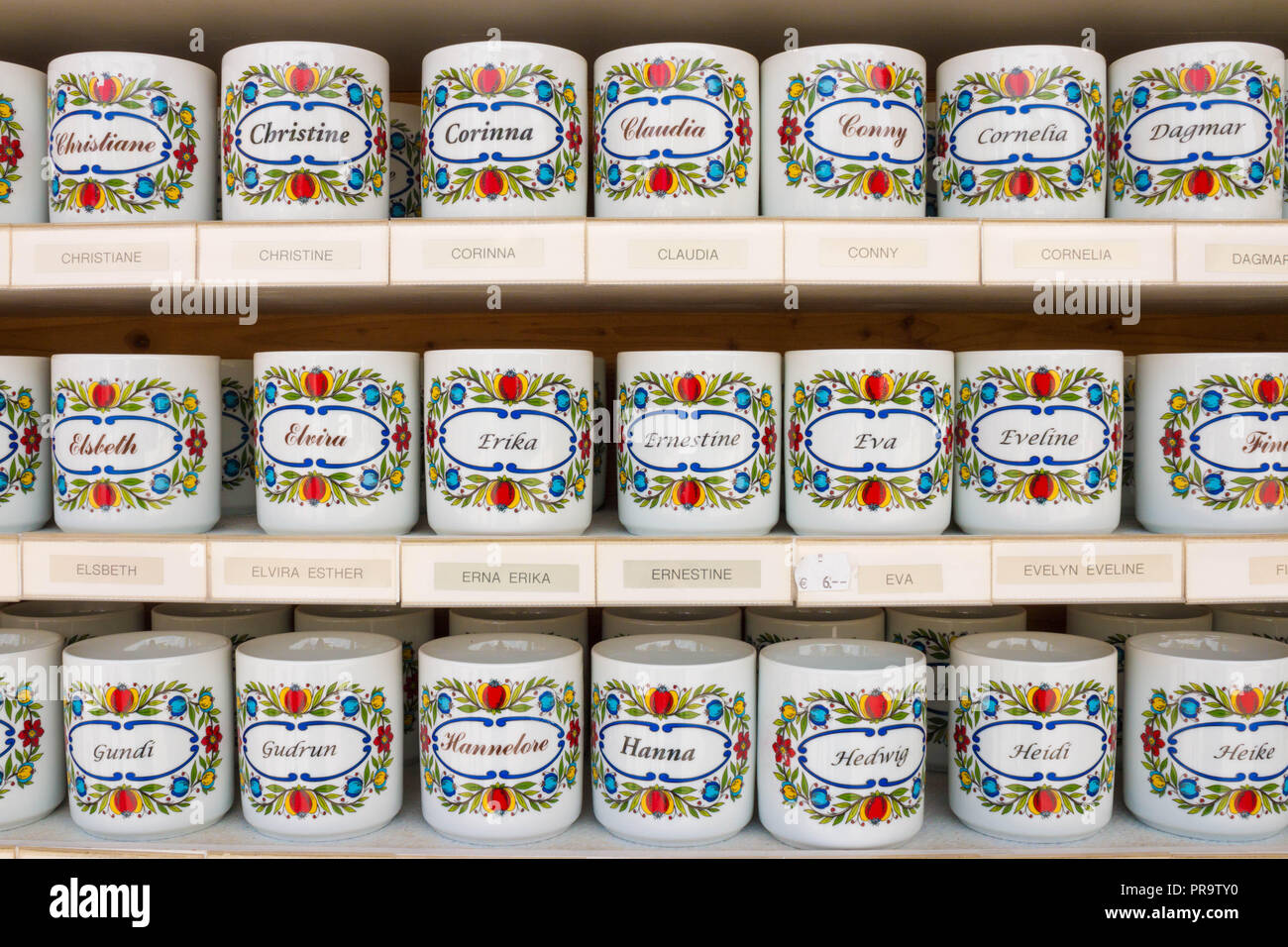 St. Gilgen, Austria - May 22, 2017: Personalized tea cups with female names on them for sale in a souvenir shop. Stock Photo